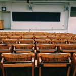 Empty chairs and blackboard in a classroom
