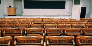 Empty chairs and blackboard in a classroom