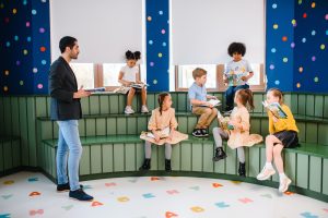 Children seated with books