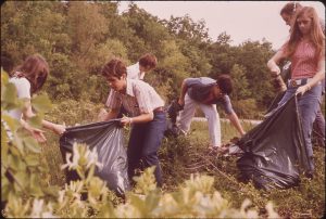 Students pick up trash along the roadside