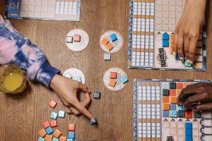 Hands playing board games