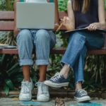 https://www.pexels.com/photo/diverse-students-using-laptop-for-teamwork-on-bench-5538591/